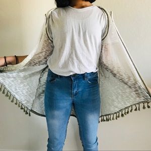 Green and white sleeveless cardigan